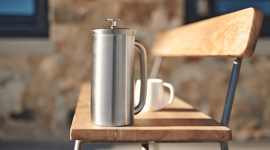 A barista gracefully pours freshly brewed coffee from a glass cafetière. The rich, aromatic stream of coffee flows into a waiting cup, promising a delightful and flavourful experience