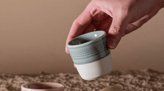 A sleek coffee machine deftly pulls a double espresso shot. The rich, aromatic stream of coffee flows into a waiting cup, promising a bold and invigorating flavour